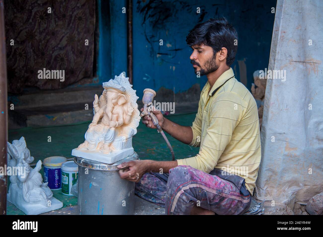 AMRAVATI, MAHARASHTRA AUGUST 25, 2018 Artist making a statue and