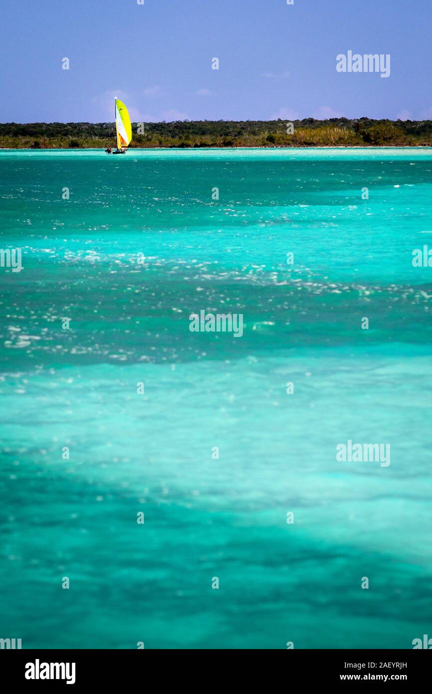 A sailboat on the 'lake of seven blues' in Bacalar, Quintana Roo, Mexico. Stock Photo