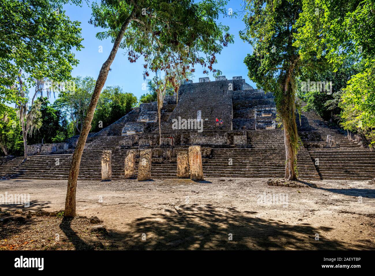 Mother and son walk down a pyramid at Calakmul Archaeological Site in Campeche, Mexico. Stock Photo