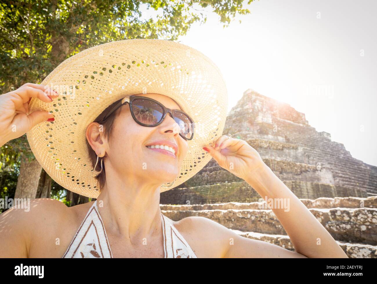 A female tourist at the Mayan ruins of Chaacchoben, Quintana Roo, Mexico. Stock Photo