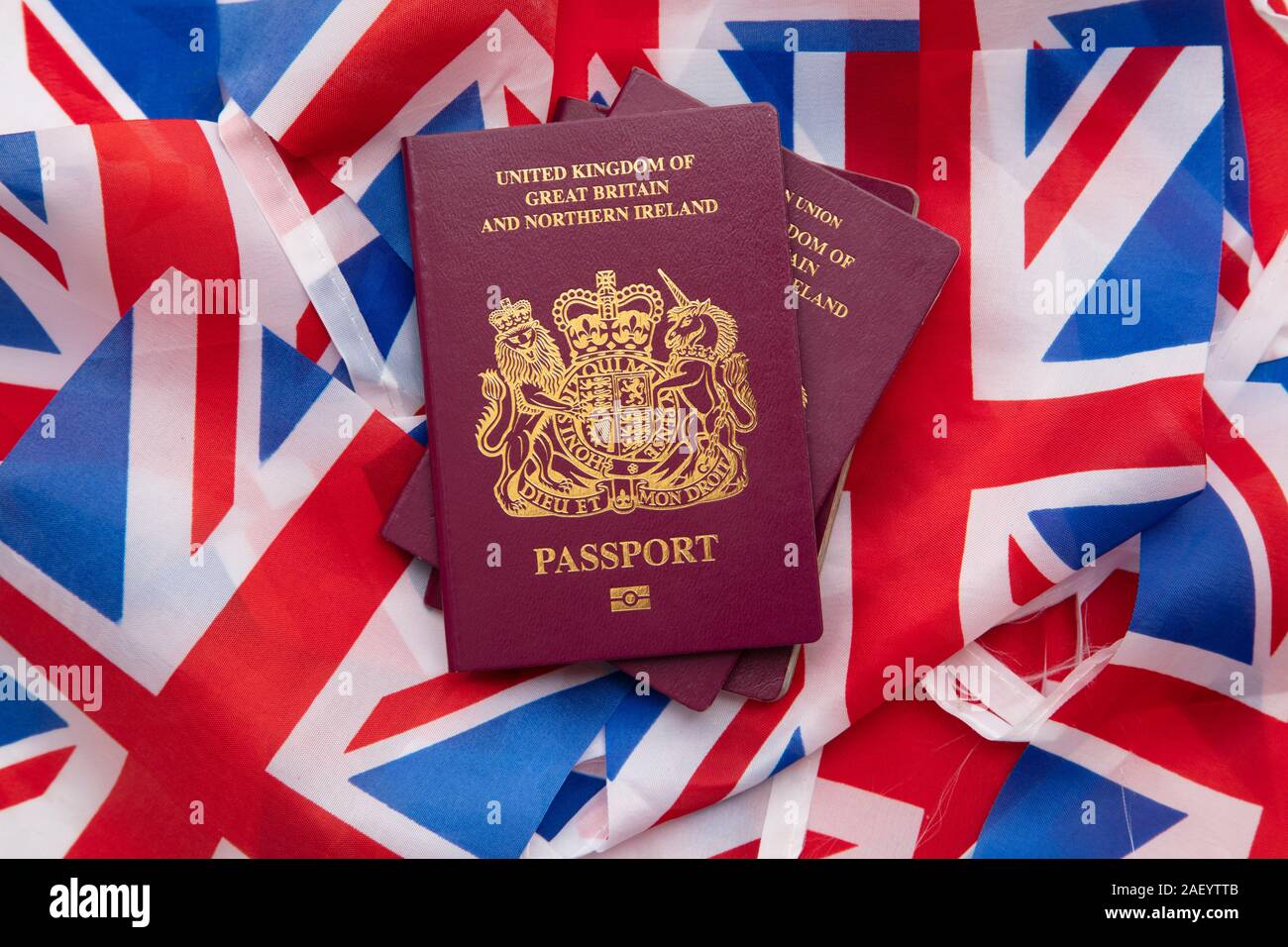 United Kingdom travel passport on a Great Britain Union Jack flag Stock Photo
