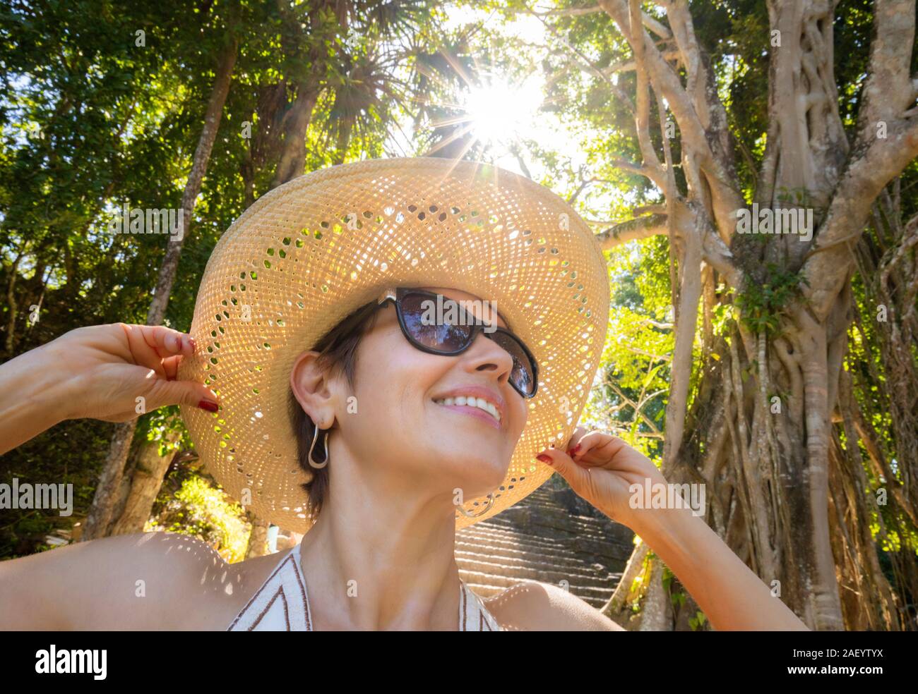 A female tourist at the Mayan ruins of Chaacchoben, Quintana Roo, Mexico. Stock Photo