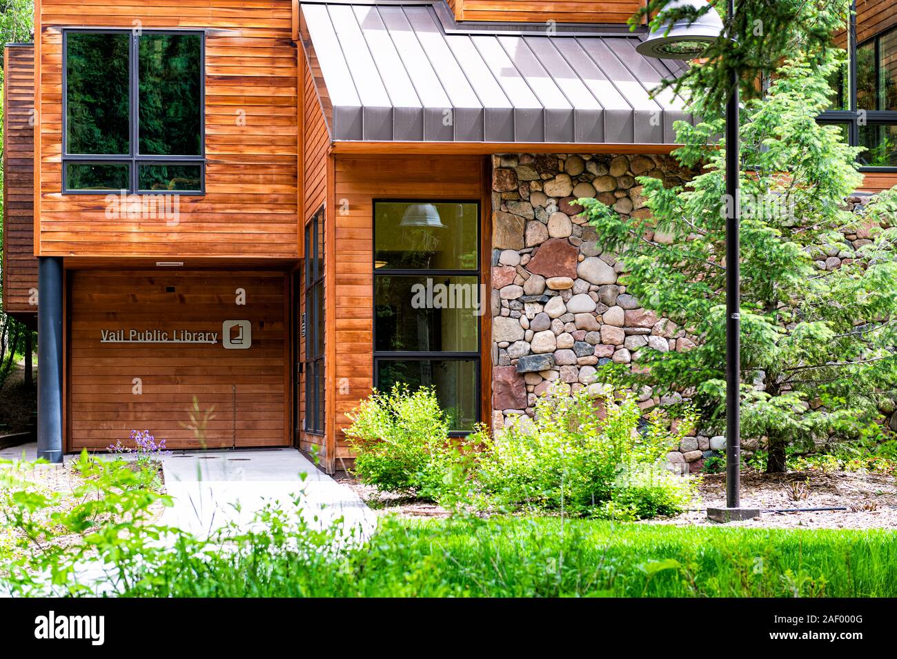 Vail, USA - June 29, 2019: Ski resort town in Colorado with closeup sign for public library modern architecture building Stock Photo