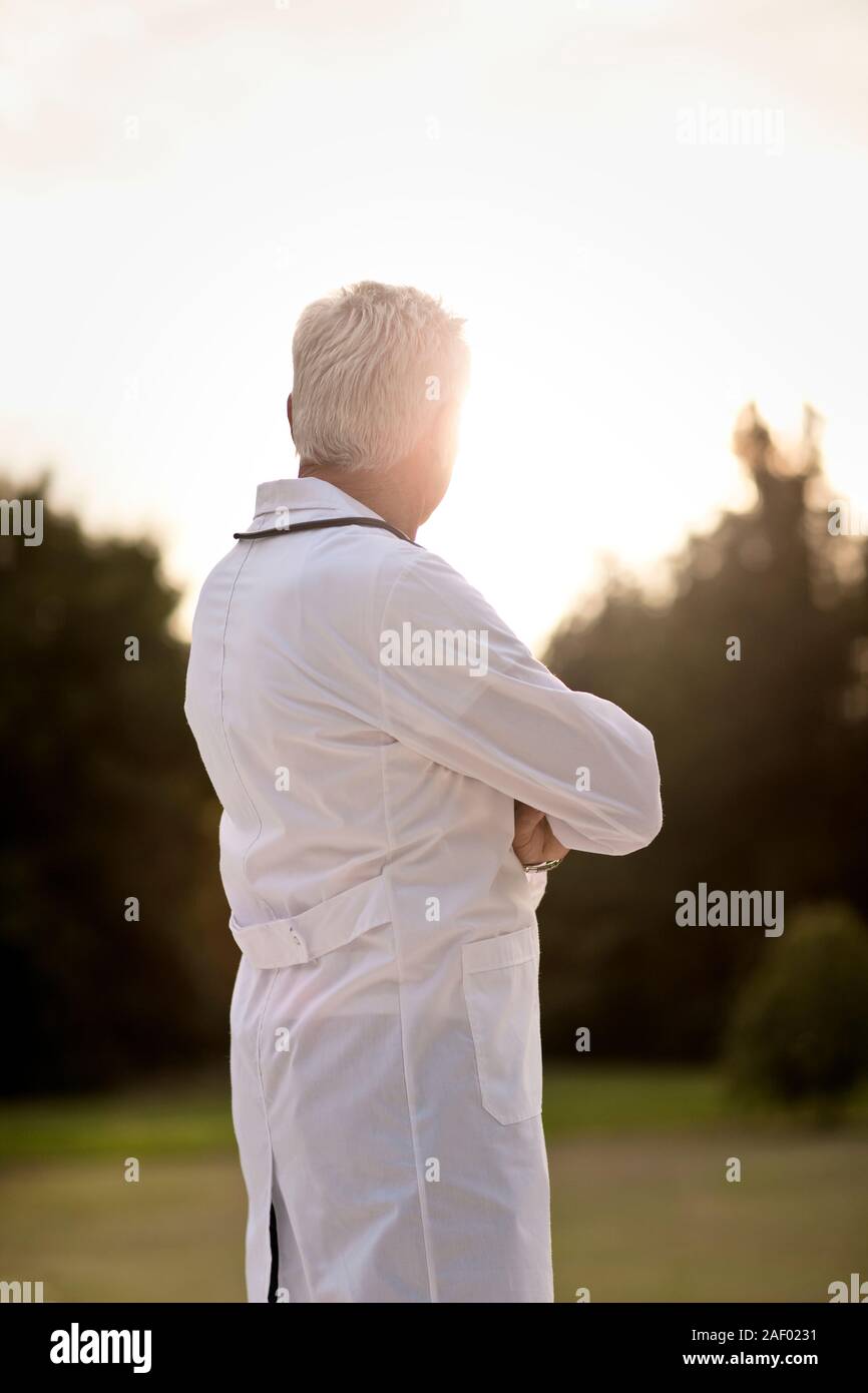 Rear view standing doctor hi-res stock photography and images - Alamy
