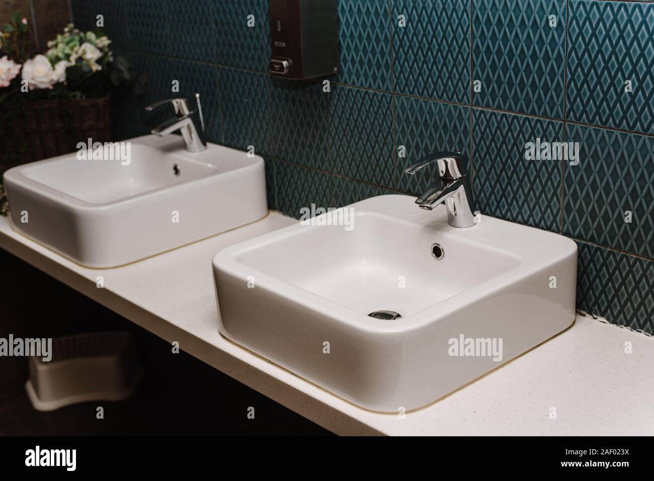 Toilet sink interior of public toilet with of washing hands. Close up. Stock Photo