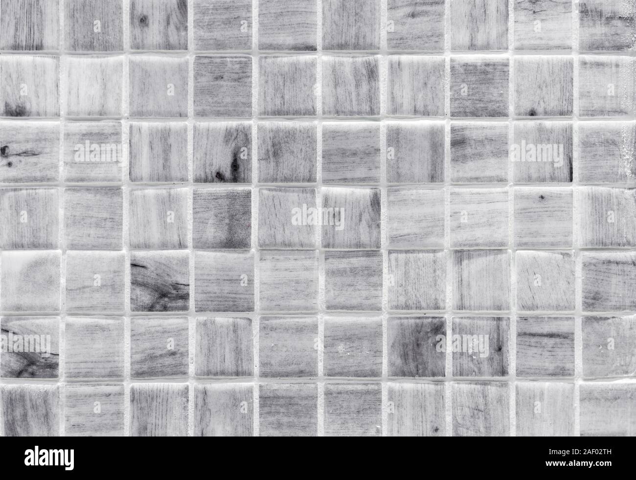 White ceramic mosaic tiles with a wood pattern. Tile texture. Stock Photo