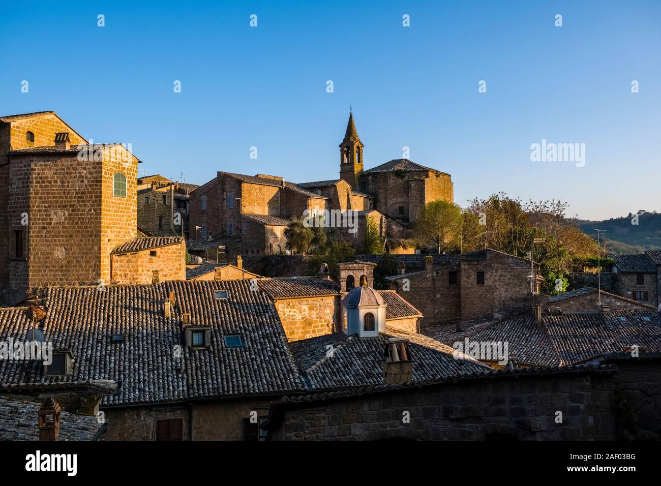 The church Chiesa di San Giovanni Evangelista, seen across the roofs of the medieval town Stock Photo