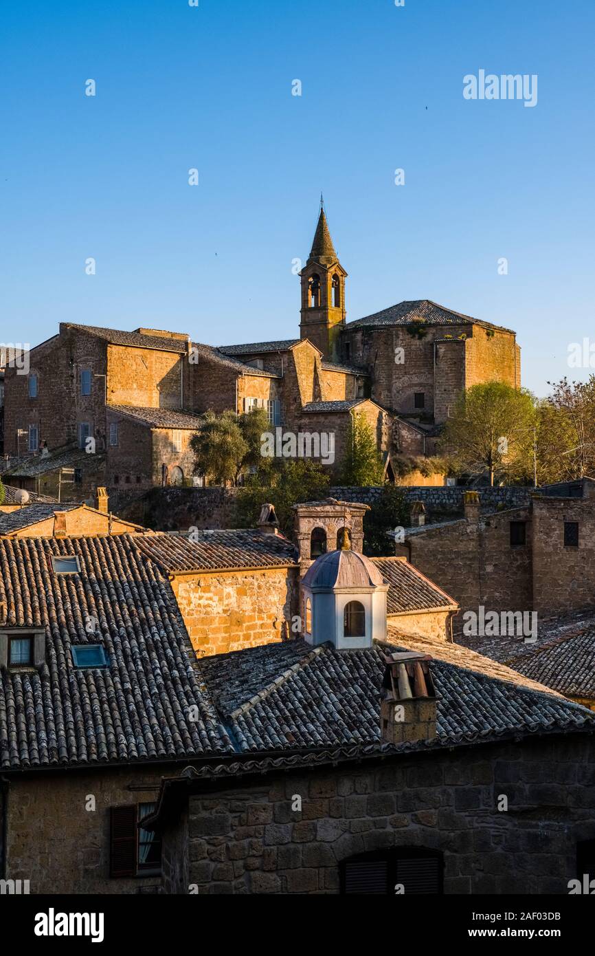 The church Chiesa di San Giovanni Evangelista, seen across the roofs of the medieval town Stock Photo