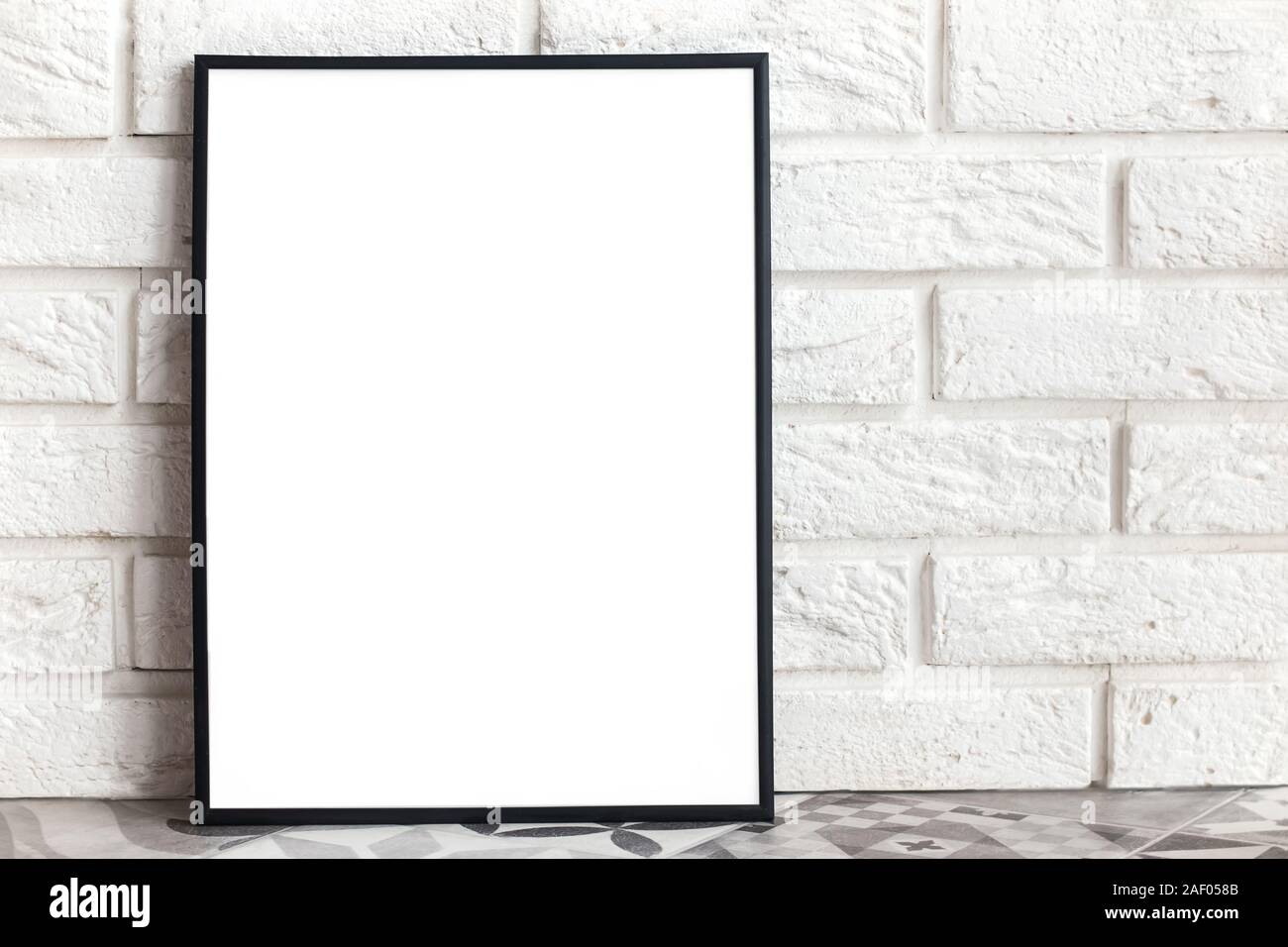 Empty frame mock-up in minimalist interior with whie brick wall Stock ...