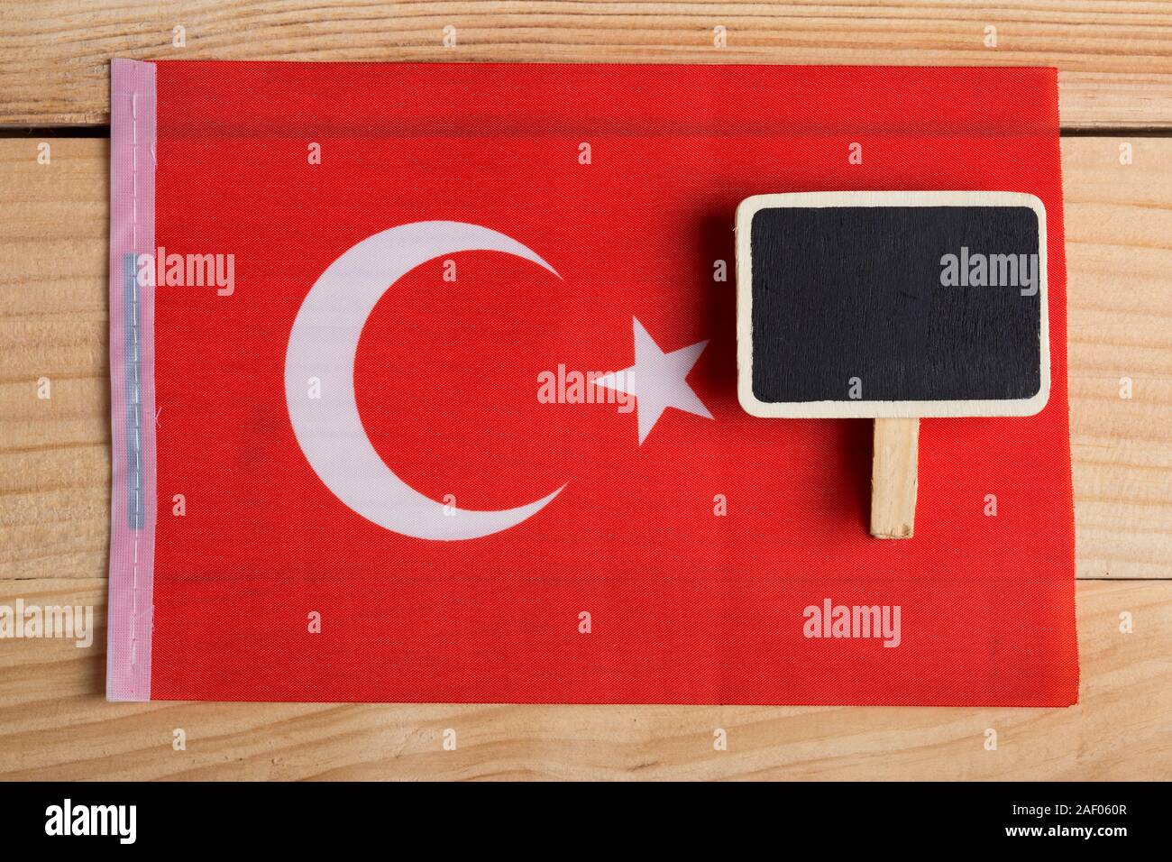 Turkey Flag and blank blackboard. Copy space Stock Photo