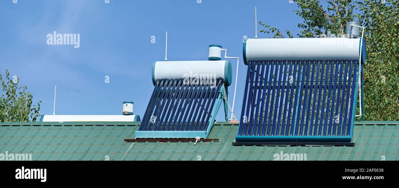 Solar water heater for home. Renewable environmental energy. Stock Photo