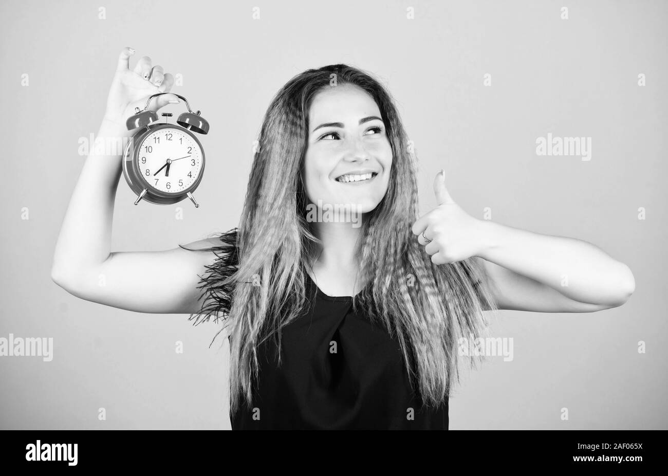 Ladies Time Sign Daylight saving time. Change time zone. Pretty girl managing her time ...