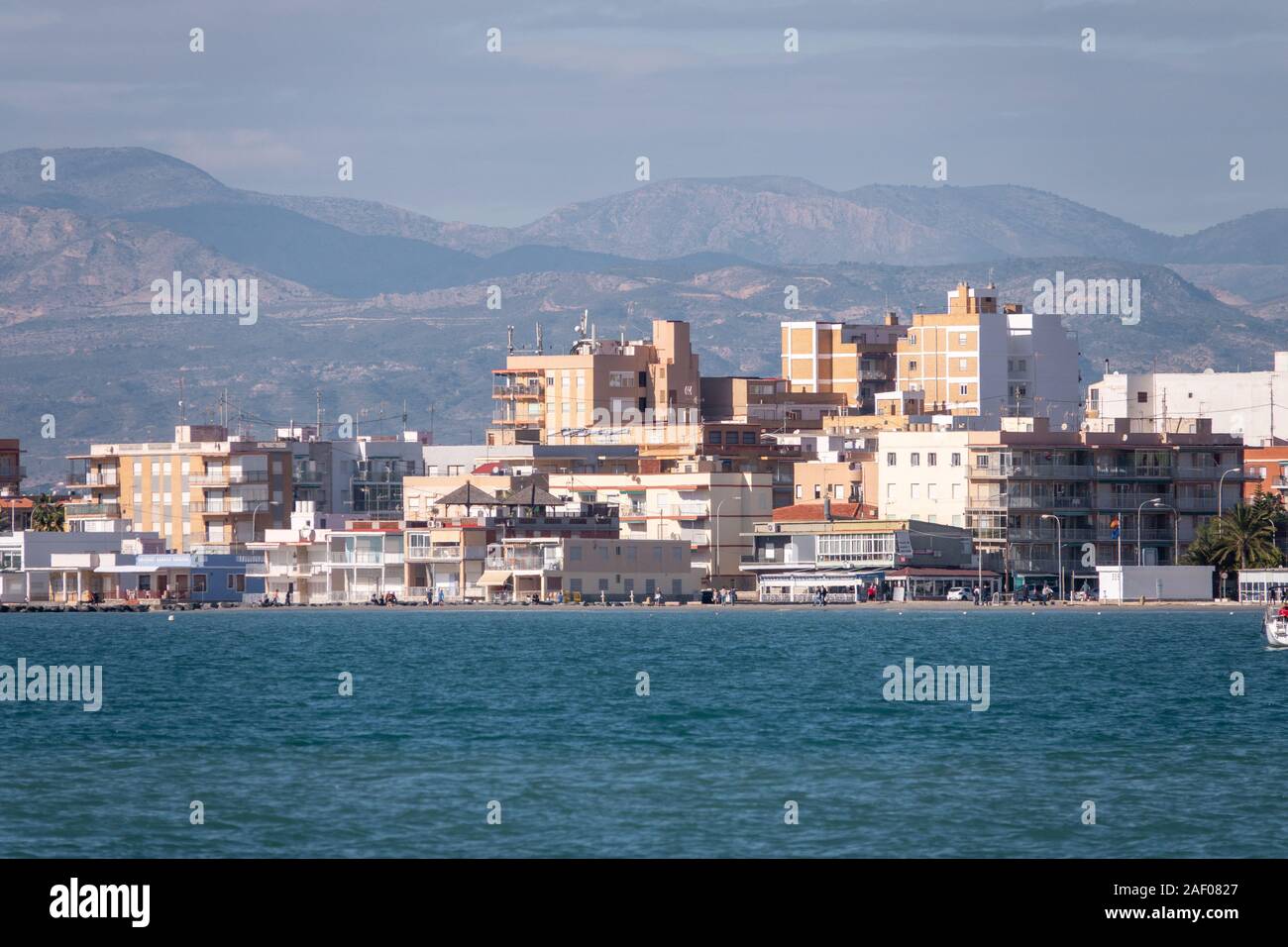Views of the seaside Spanish resort of Santa Pola, Alicante, Spain taken across the harbour with heat haze distortion Stock Photo