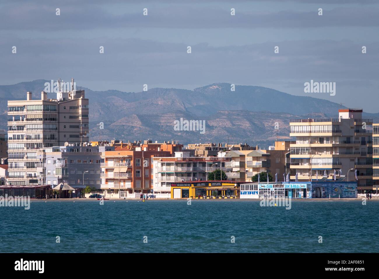 Views of the seaside Spanish resort of Santa Pola, Alicante, Spain taken across the harbour with heat haze distortion Stock Photo