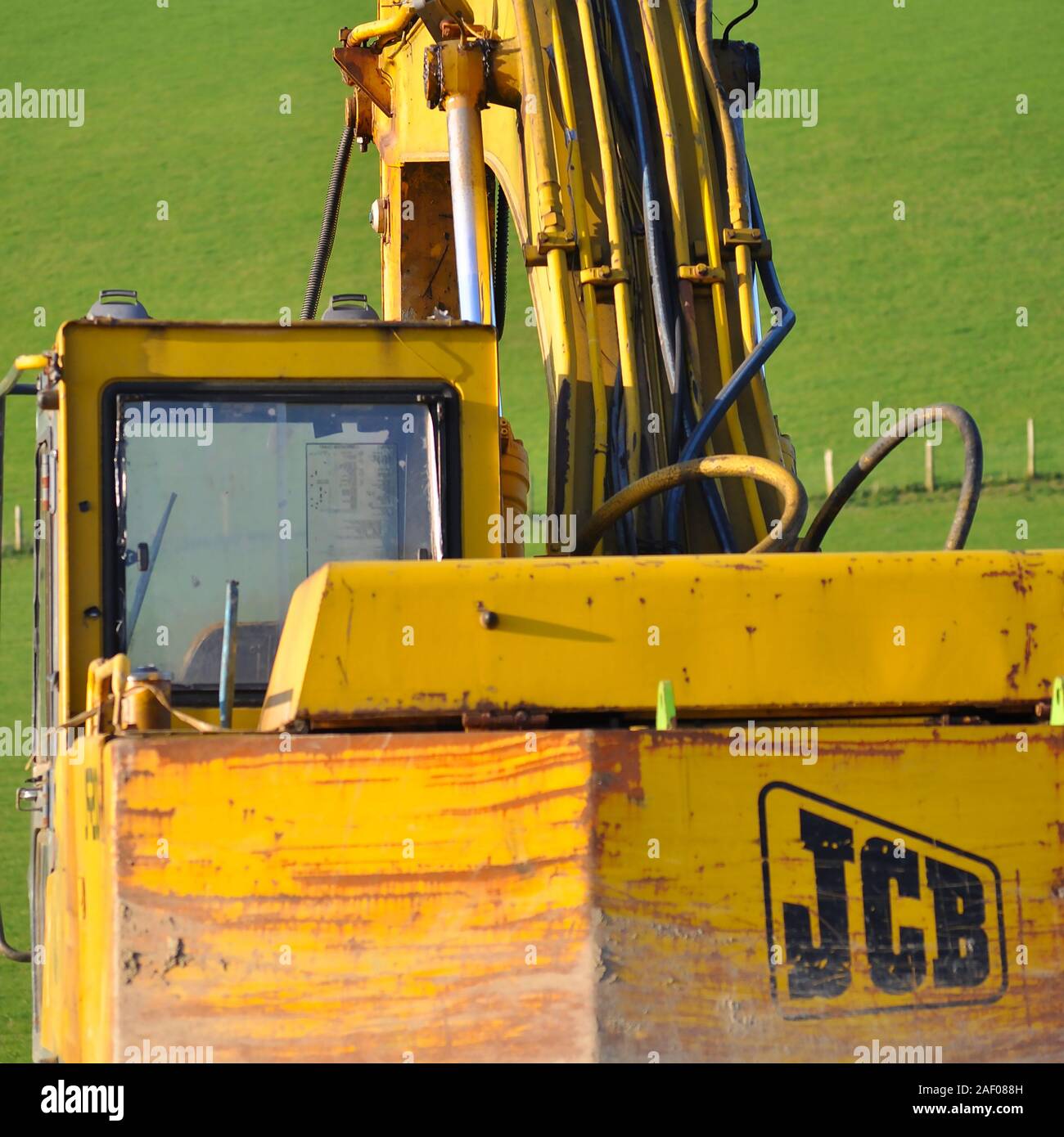 Aberystwyth Ceredigion Wales/UK March 03 2012: Rear view of a a JCB digger in a field Stock Photo