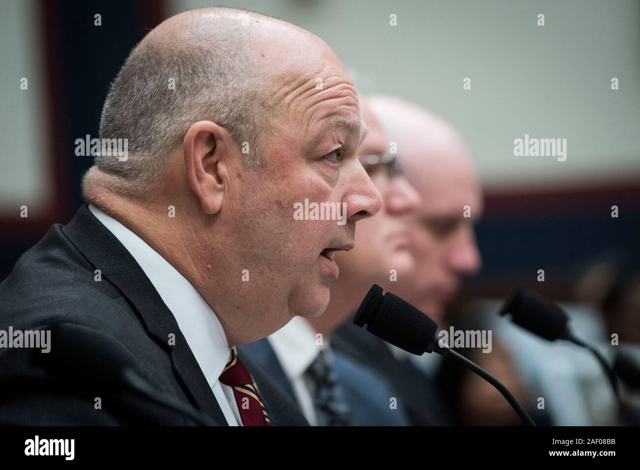 Washington, USA. 11th Dec, 2019. Steve Dickson (Front), chief of the Federal Aviation Administration (FAA), testifies before the House Committee on Transportation and Infrastructure during a hearing on 'The Boeing 737 MAX: Examining the Federal Aviation Administration's Oversight of the Aircraft's Certification' in Washington, DC, the United States, on Dec. 11, 2019. Steve Dickson said Wednesday that aviation regulators won't likely clear Boeing's troubled 737 Max airplanes for flight until 2020. Credit: Sarah Silbiger/Xinhua/Alamy Live News Stock Photo