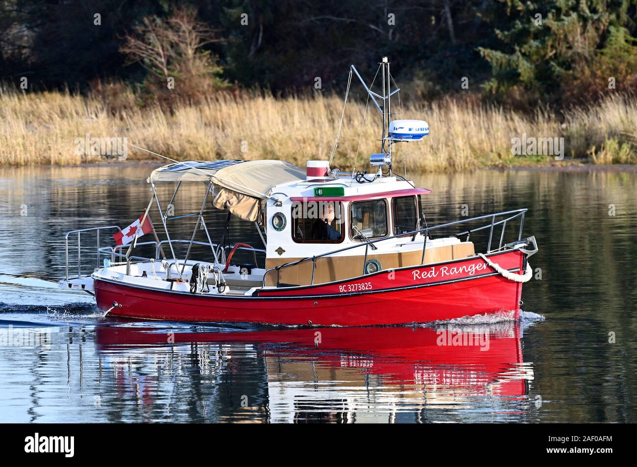 Pleasure boat on the Puntledge River, Courtenay, Vancouver Island,  British Columbia, Canada. Stock Photo