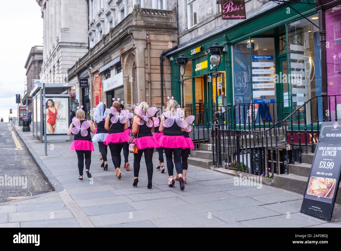 Group of ladies costumed in bees in a hen party walking down  Hanover St,,  Edinburgh, Scotland, UK Stock Photo