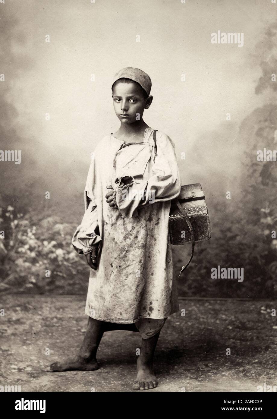 Barefoot shoeshine boy, North Africa, possibly Egypt, c.1880s. Stock Photo