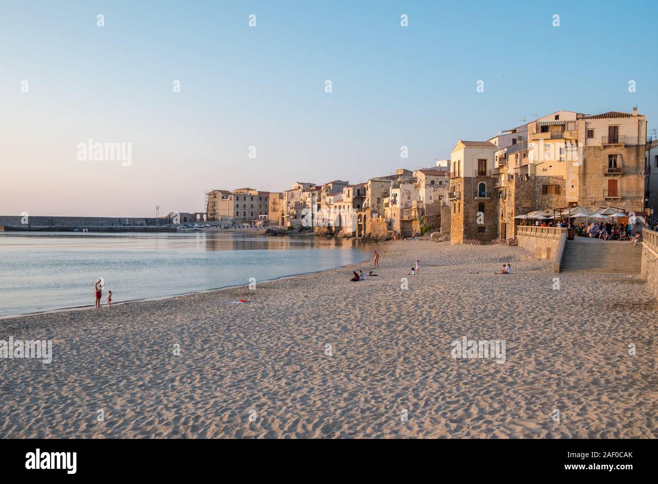 The beachfront and the Old Town in Cefalù, Sicily. Historic Cefalù is a major tourist destination on Sicily. Stock Photo