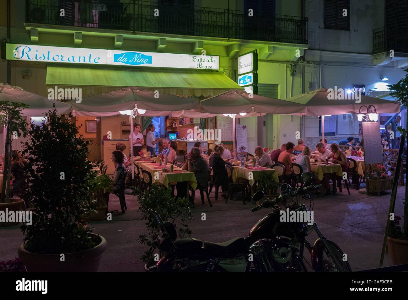 Restaurant by night in Cefalù, Sicily. Historic Cefalù is a major tourist destination on Sicily. Stock Photo