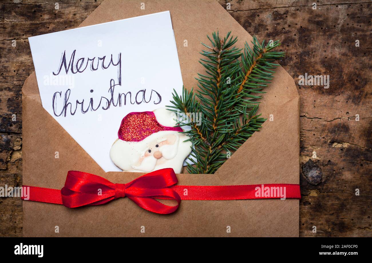 Merry Christmas card in a decorated envelope for happy winter holidays Stock Photo