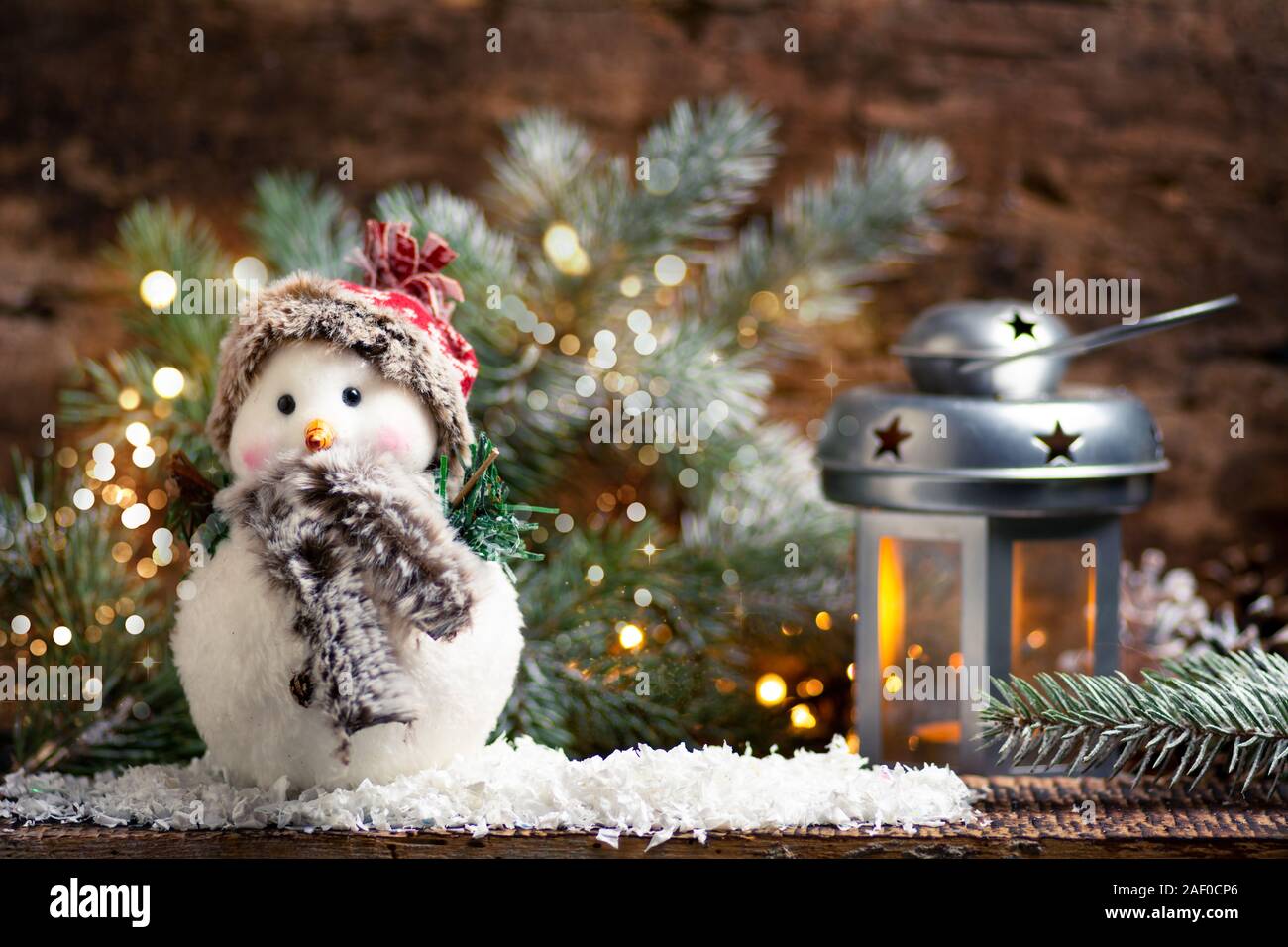 Snowman and iluminated Christmas decorations home arrangement Stock Photo