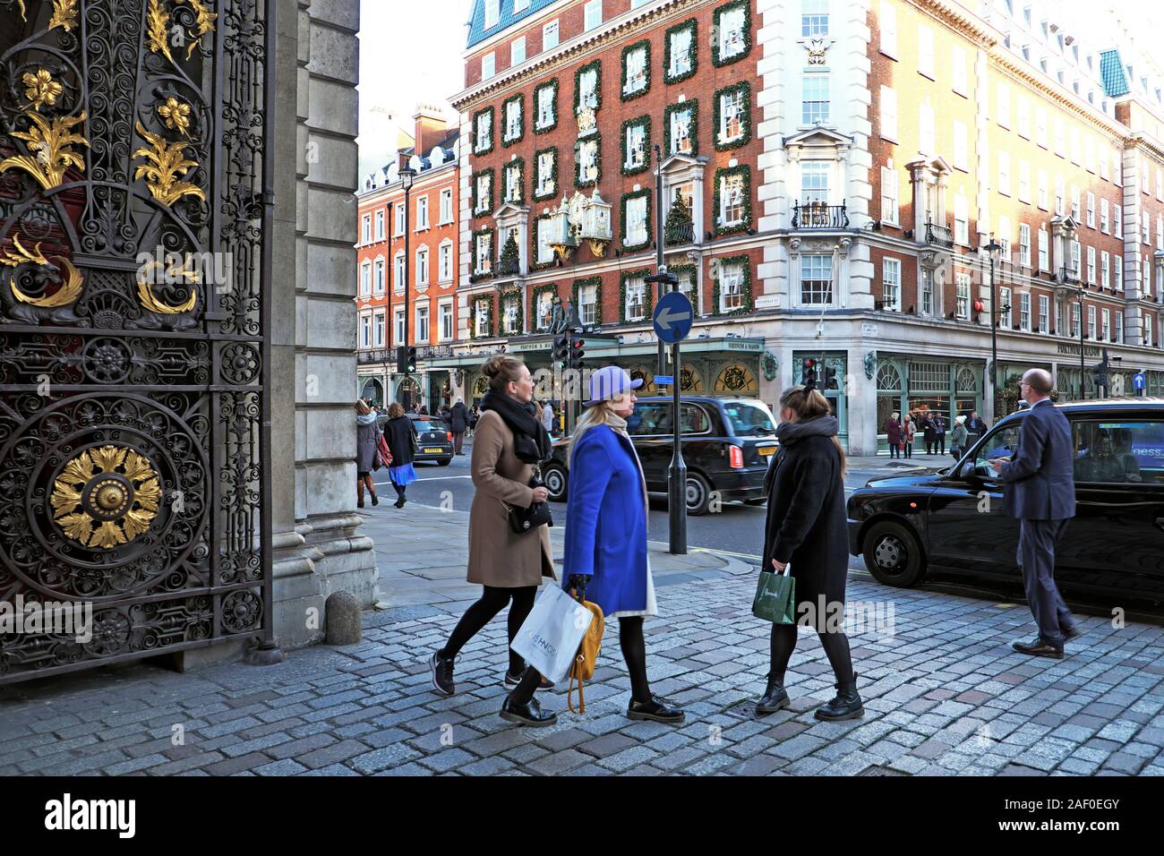 Christmas shoppers outside the gates of the Royal Academy of Art