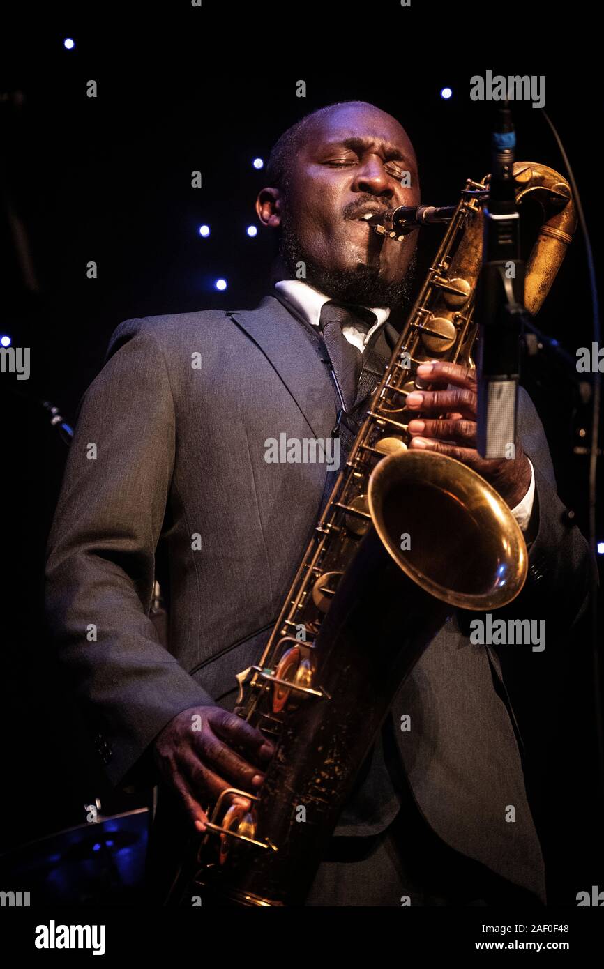 Toni Kofi plays baritone sax at Scarborough Jazz Festival 2019 Stock Photo