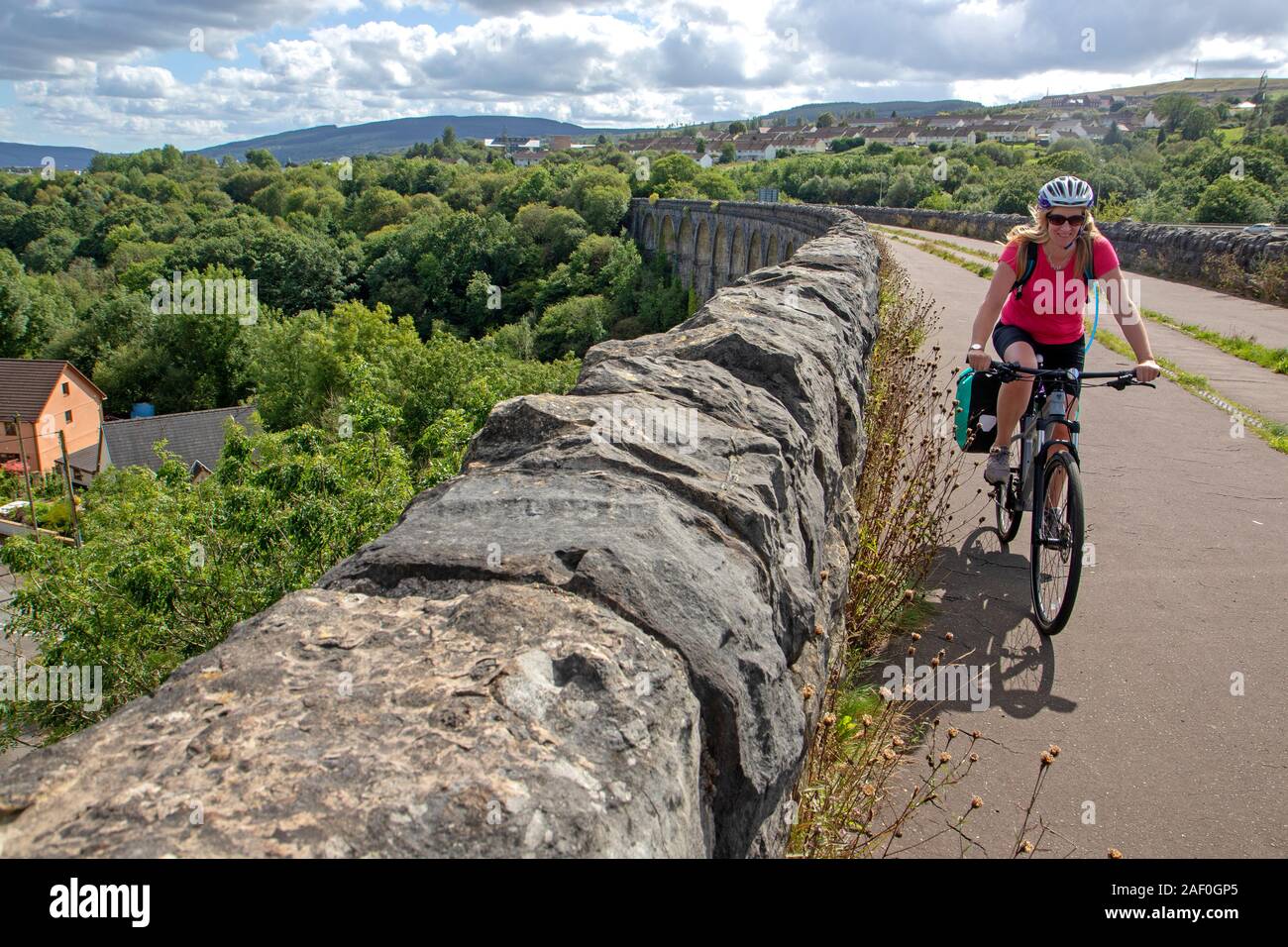 Cycling across the Cefn-coed viaduct at Merthyr Tydfil, part of the Taff Trail Stock Photo