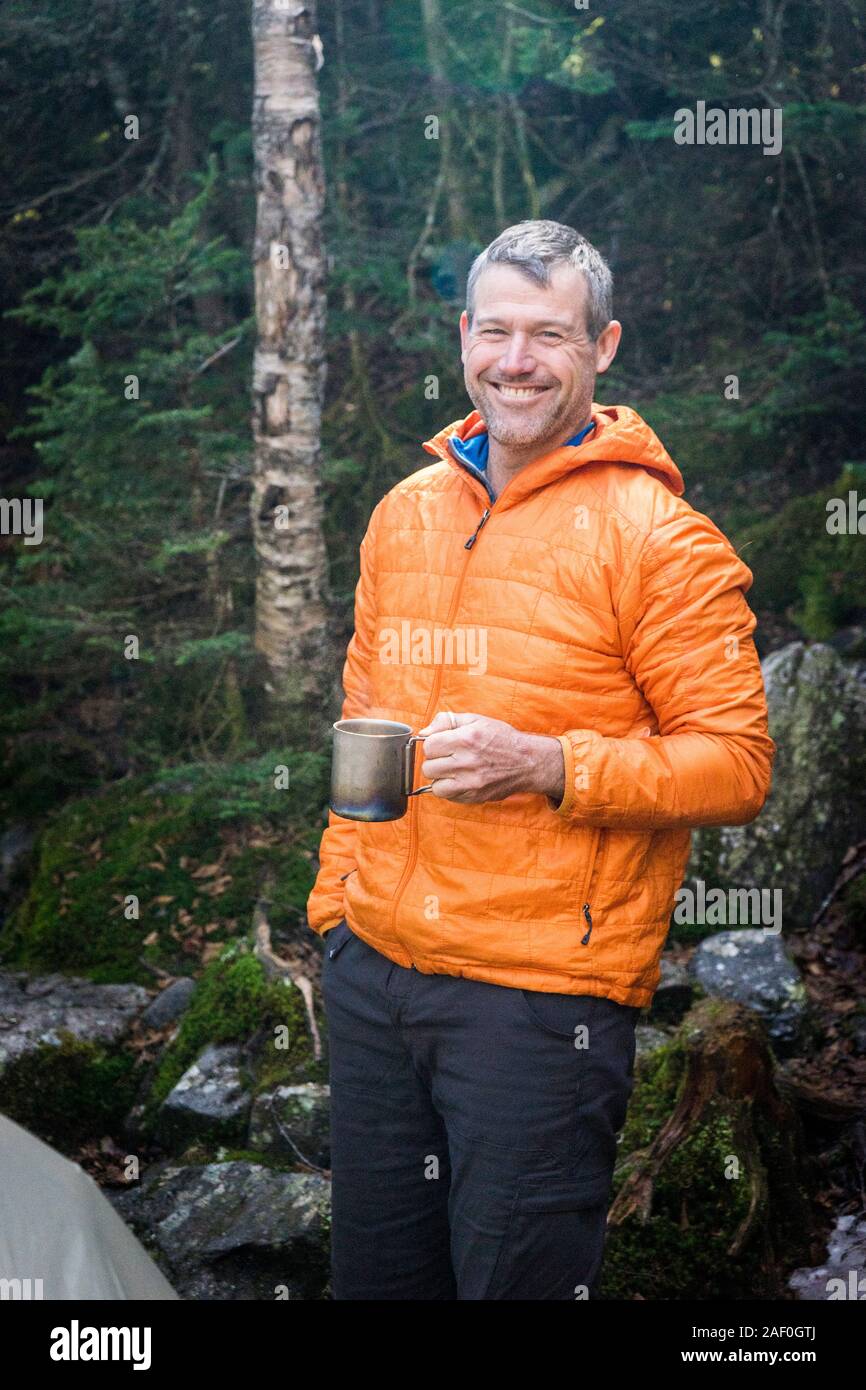 Man enjoying a campsite coffee in the morning Stock Photo