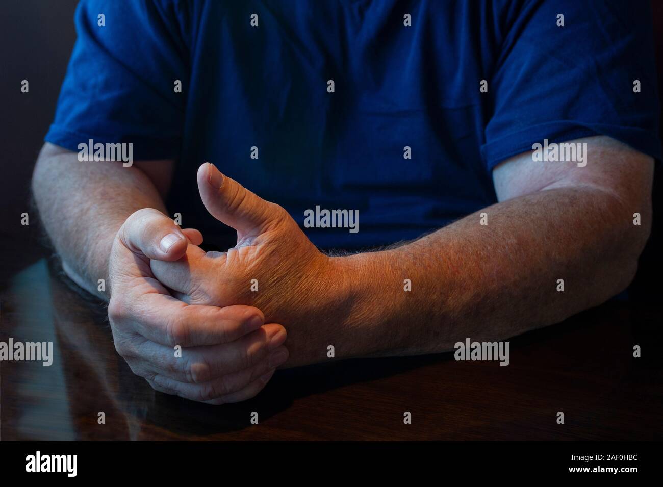 senior man communicating with hand gestures Stock Photo