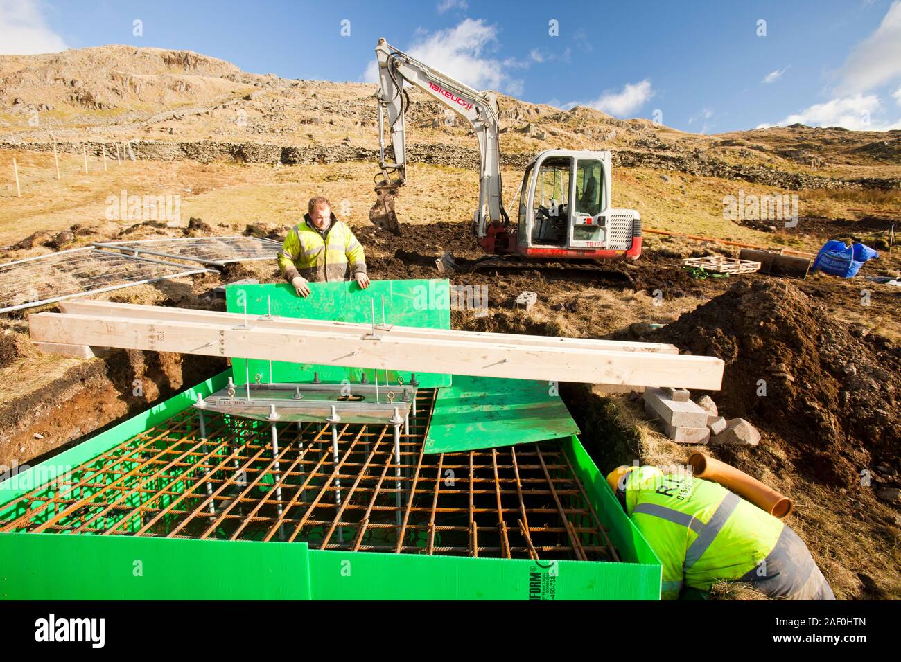 Work starts on the initial groundworks for 3 wind turbines to be constructed behind the kirkstone Pass Inn on kirkstone Pass in the Lake District, UK. Stock Photo