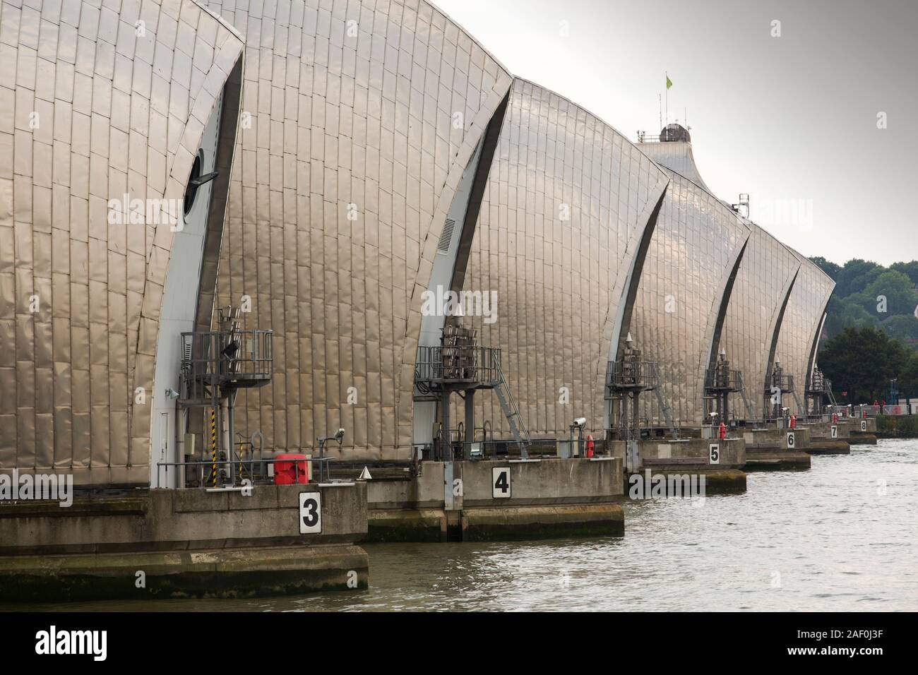 The Thames barrier on the River Thames in London. It was constructed to protect the capital city from storm surge flooding. Recent predictions show it Stock Photo