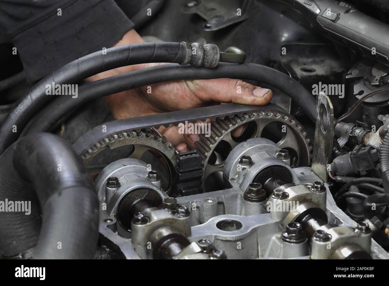 How Much To Replace Timing Belt >> Car Mechanic Replacing Timing Belt At Camshaft Of Modern How Much To Replace Timing Belt >> Car Mechanic Replacing Timing Belt At Camshaft Of Modern