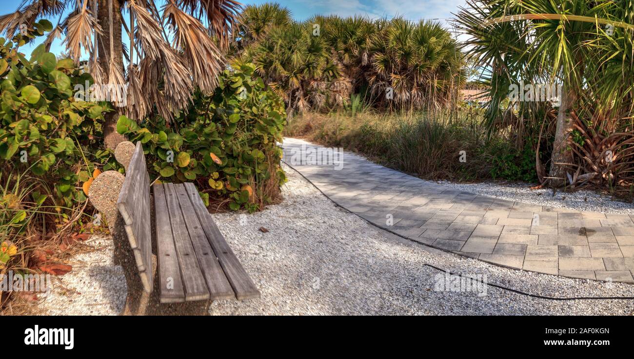 Bench on the way to the beach in Boca Grande on Gasparilla Island in Florida Stock Photo