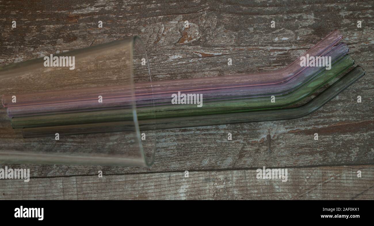 four colored drinking straws of glass Stock Photo