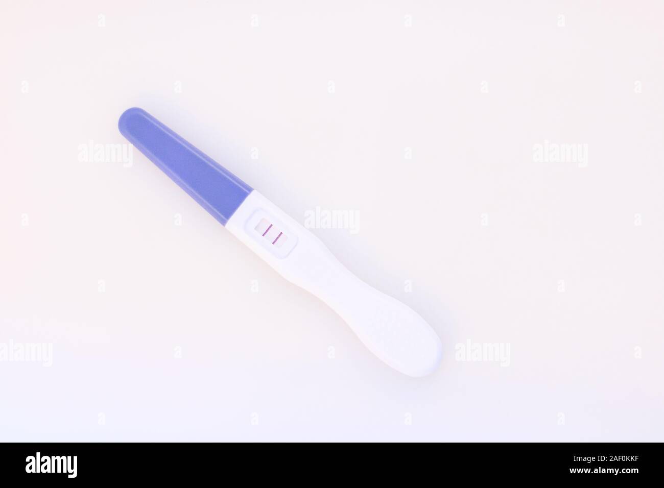 Pregnancy test showing a positive result isolate on white background. Stock Photo