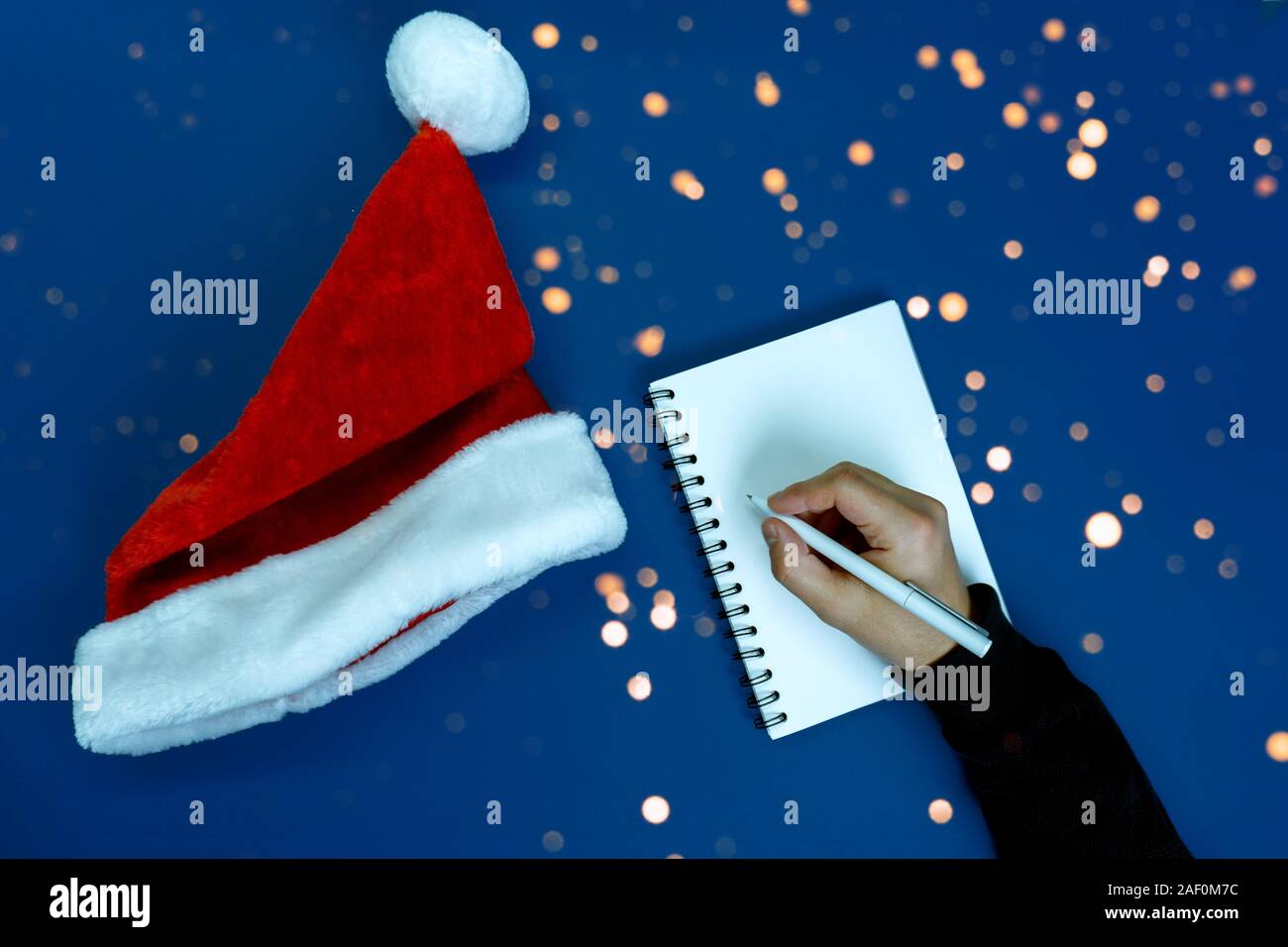 Man writes plans and goals. Stock Photo