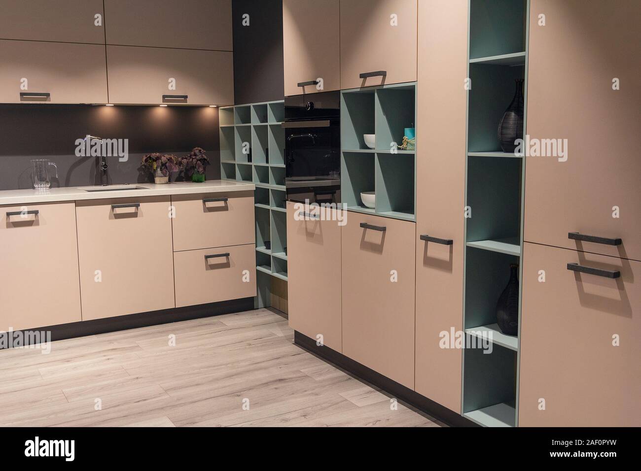 Modern kitchen with beige kitchen cabinets. Interior Stock Photo - Alamy