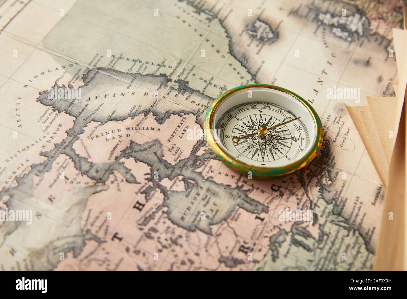 vintage compass on map background Stock Photo - Alamy