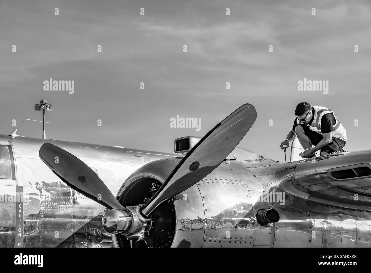 Aircraft Lockheed P-38 Lightning maintenance by a mechanic. . SIAF Airhow, Sliac, Slovakia 2018 Stock Photo