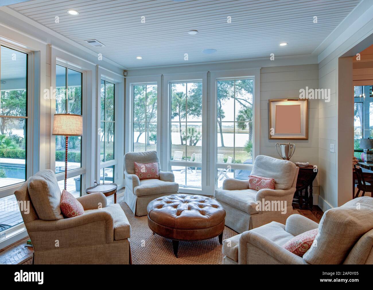 Beautiful sitting room interior with view out onto waterfront property
