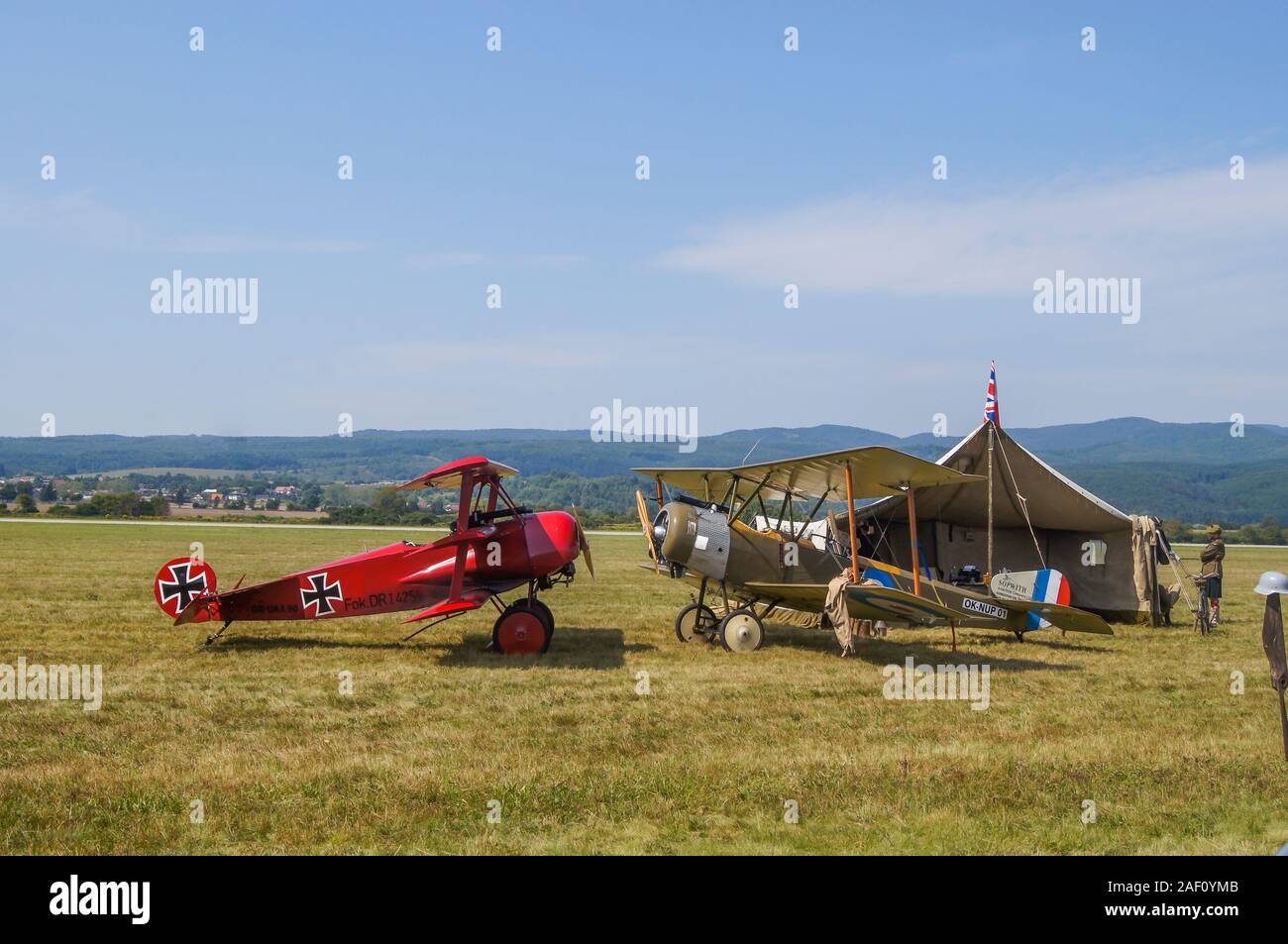German Fokker Dr.I, (Red Baron) and British  Sopwith 1 1/2 Strutter 'face to face' by the military tent. SIAF Airhow, Sliac, Slovakia 2017 Stock Photo