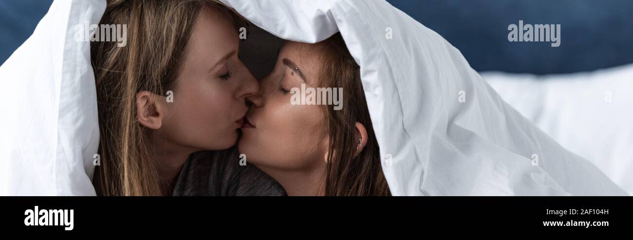 Lesbians Kissing On Bed