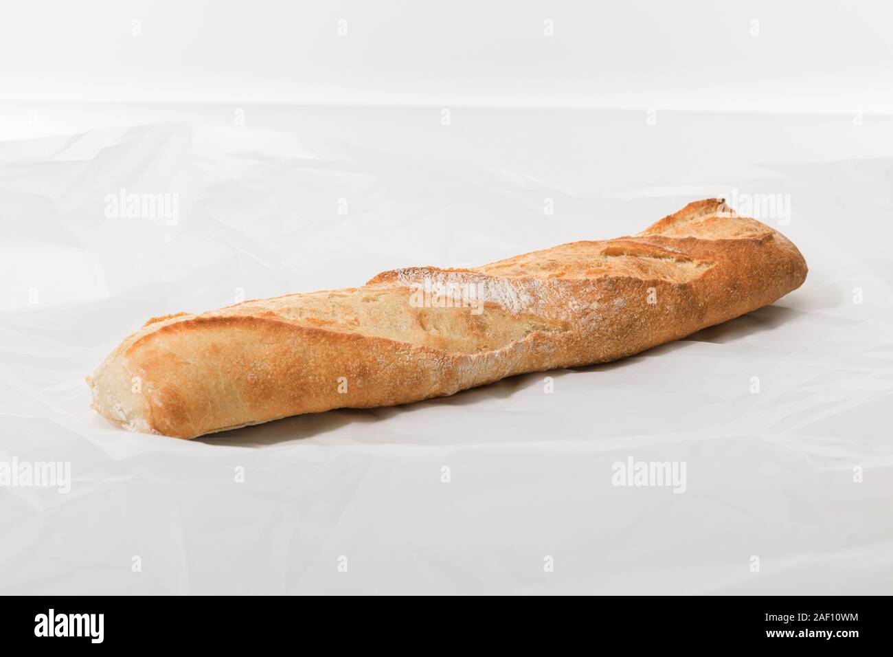 fresh baguette on textured white background Stock Photo - Alamy