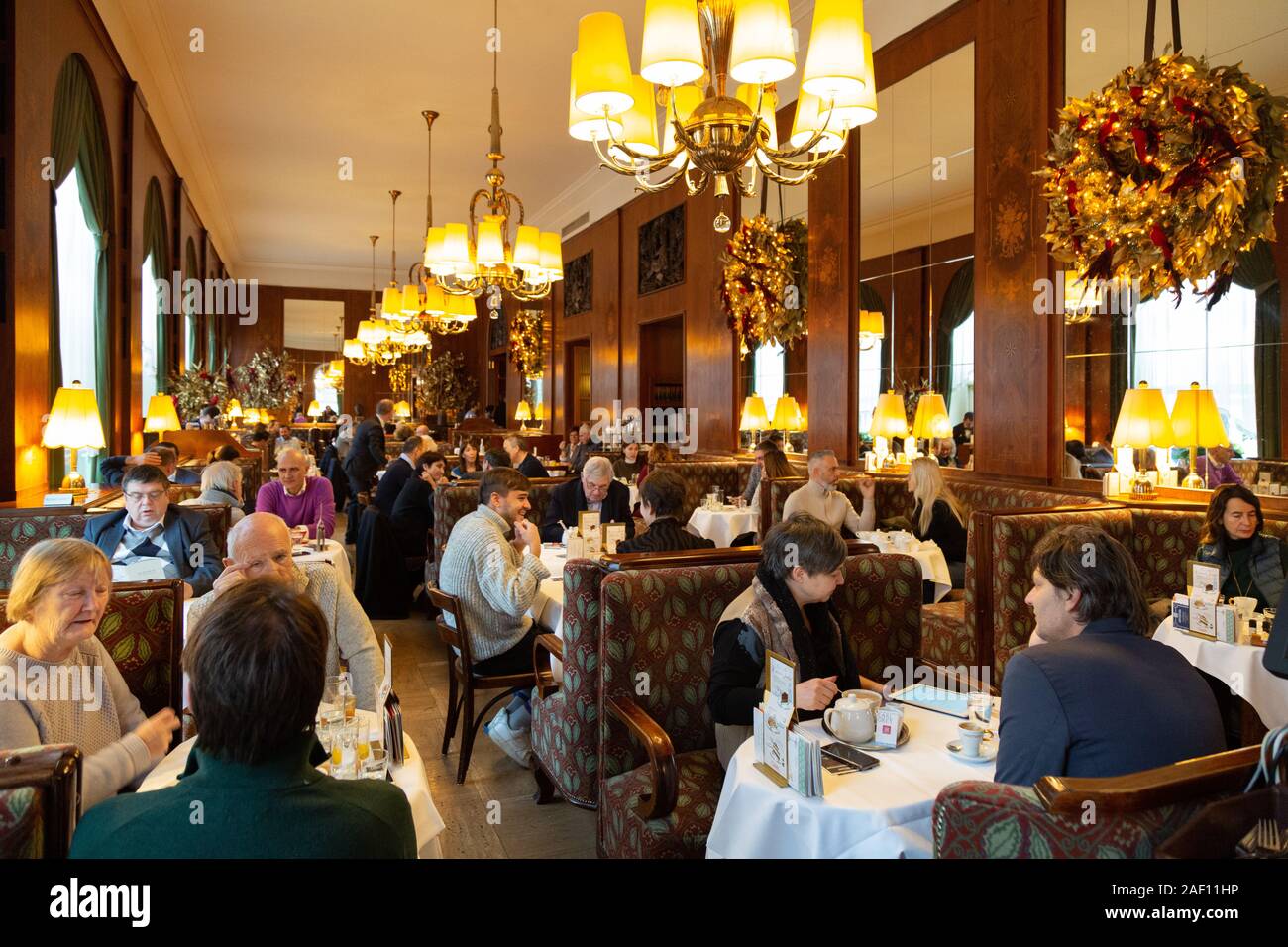 Vienna Coffee house - people having coffee and breakfast in the interior of the ornate Cafe Landtmann, Vienna, Austria Europe Stock Photo