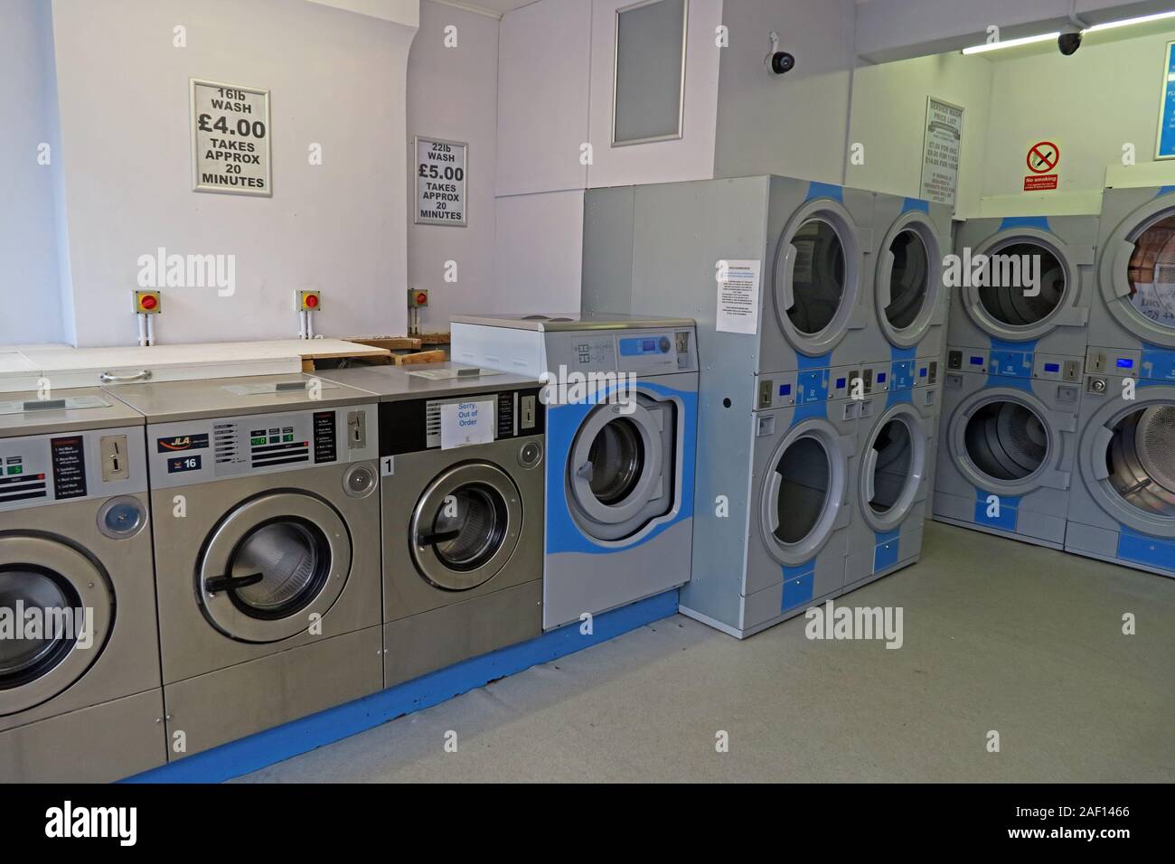 Interior of Eastover Launderette Laundry Room,with commercial washing machines and stacked dryers in Bridgwater, Somerset, England, UK. Stock Photo
