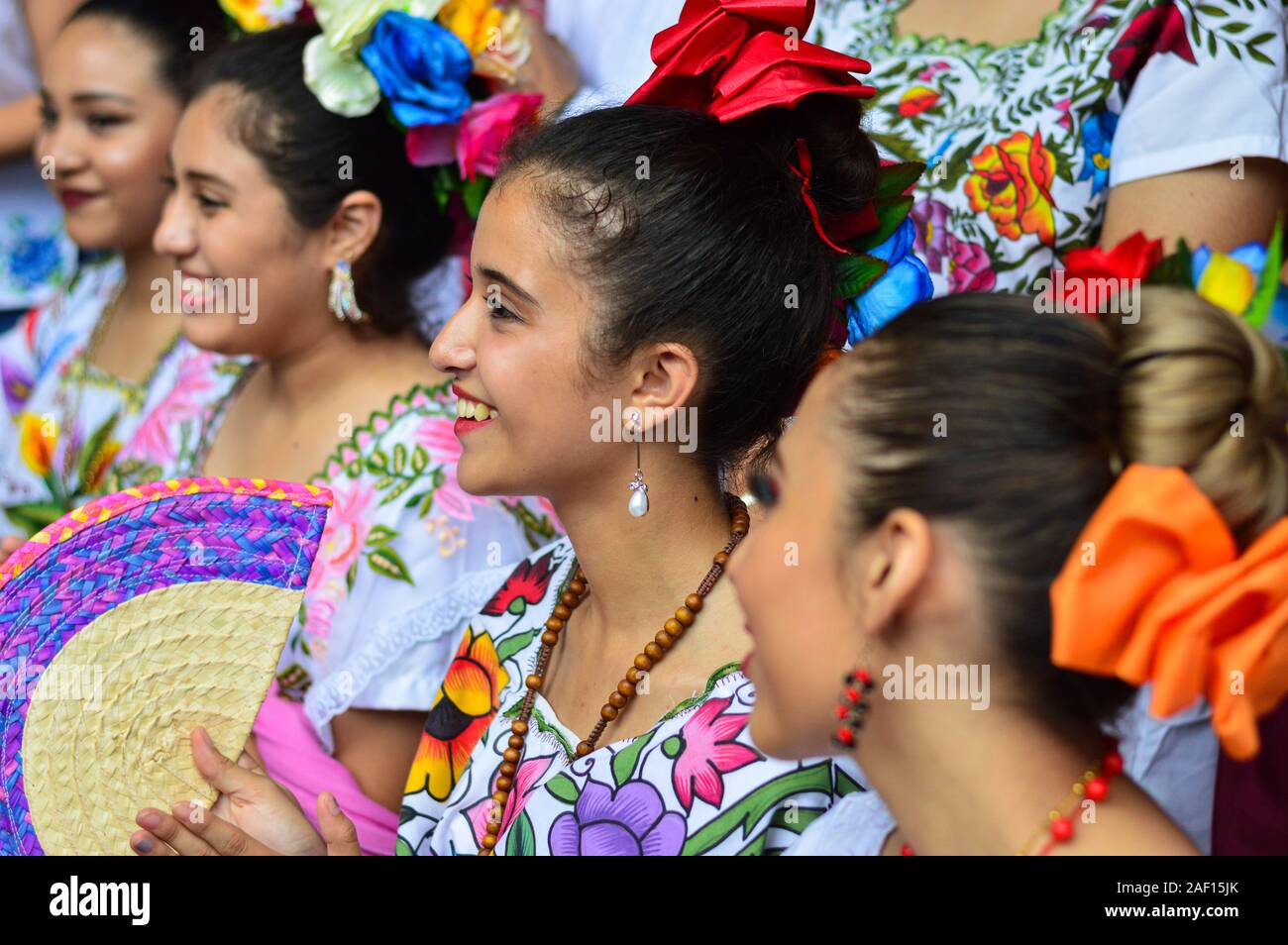 Young women from Yucatan wearing traditional attire during day of the dead celebrations. Stock Photo