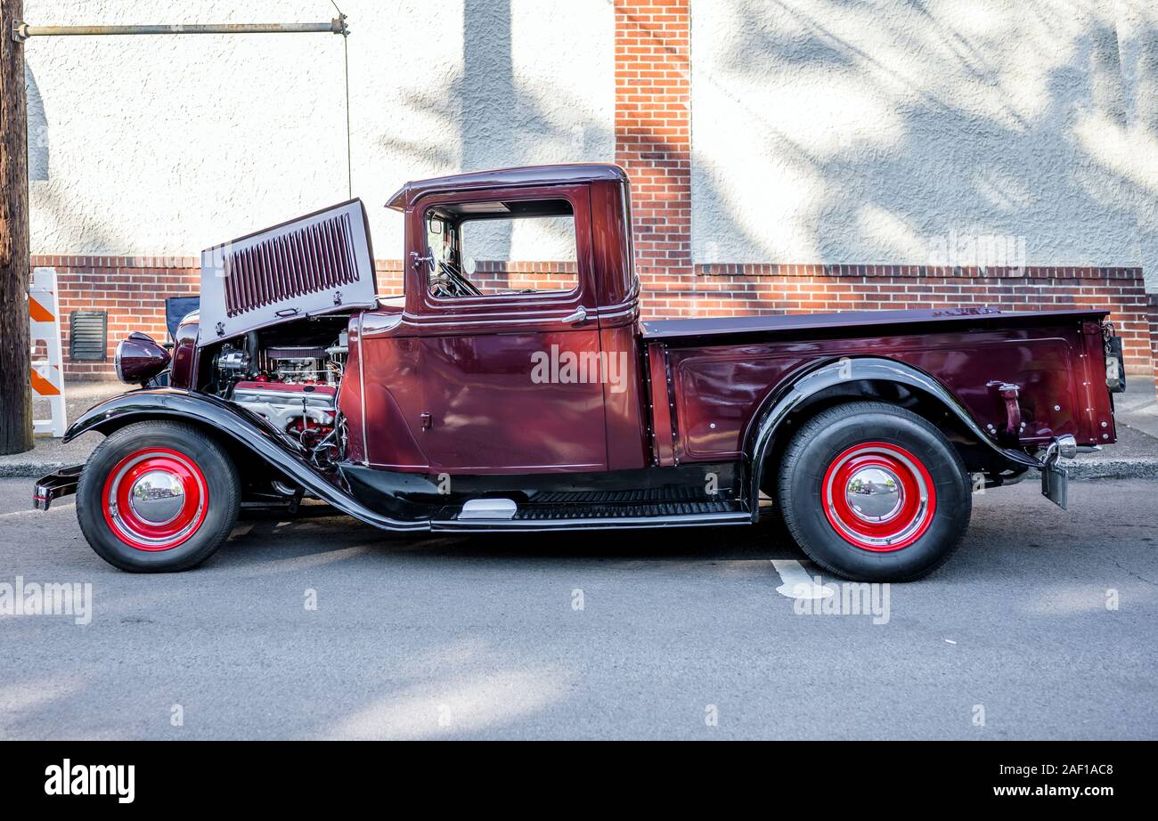 Elegant Burgundy old vintage retro truck with large convex wings and ...